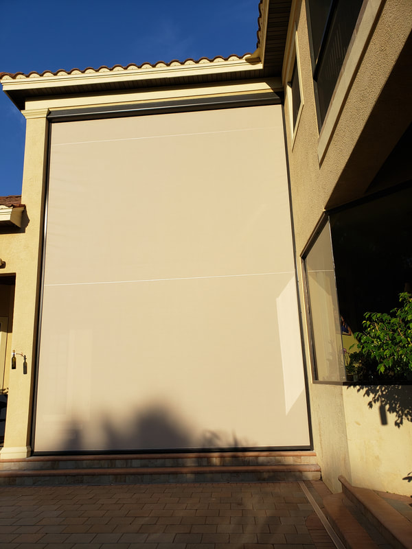 A house with a large white garage door