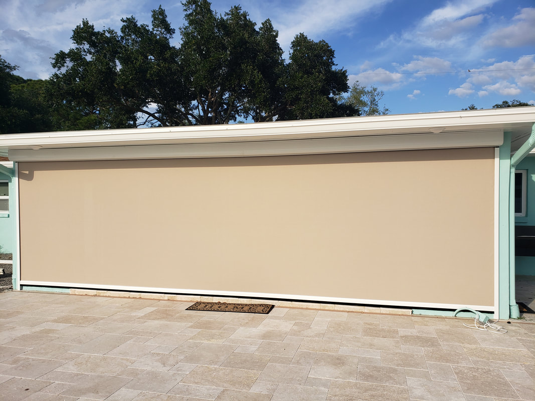 A garage with a tan covering on the side of it