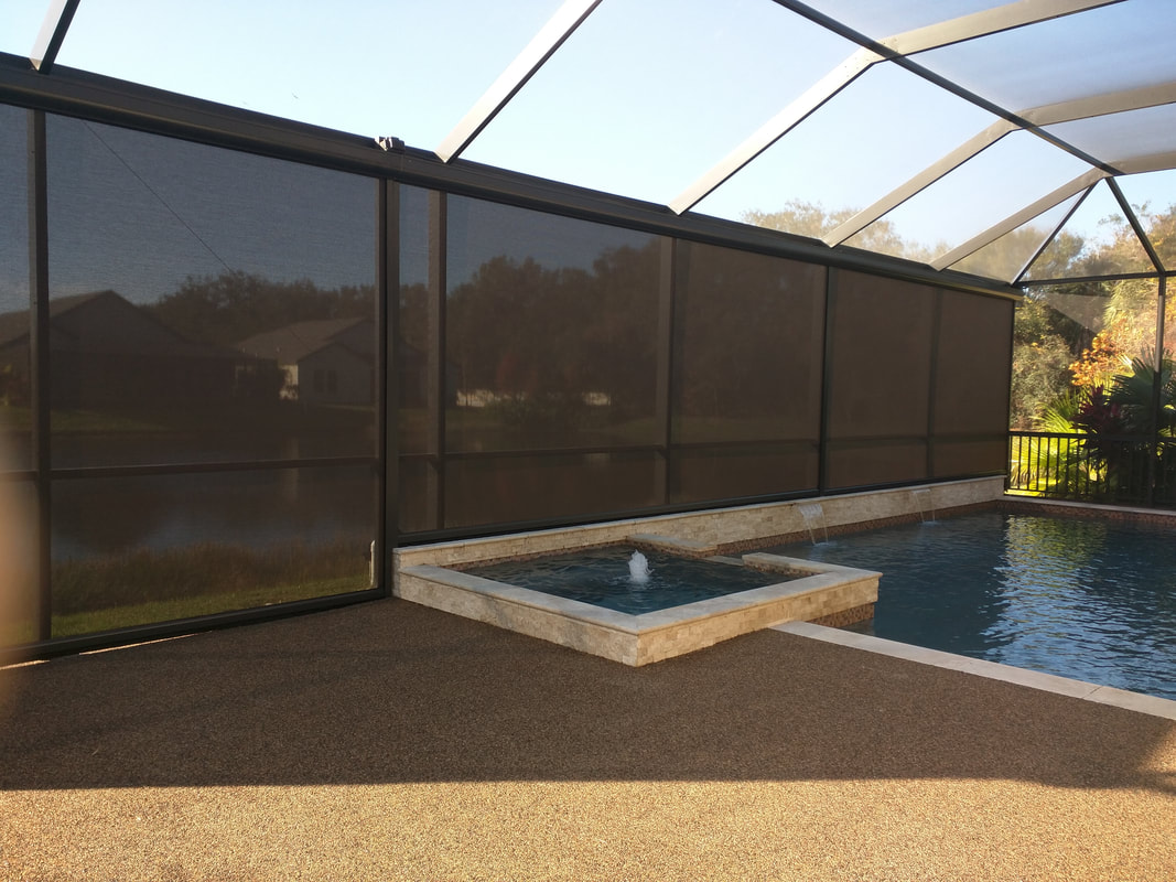 A pool inside of a house next to a fence